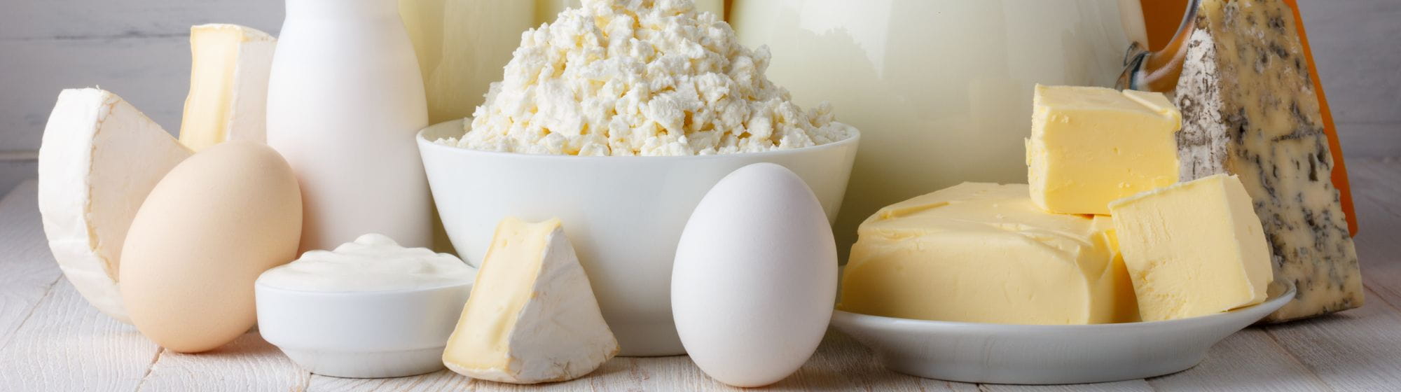 Many dairy products on a plate such as eggs, cheese and so 