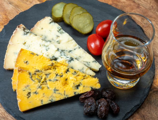 Charcuterie and cheese board paired with a cocktail