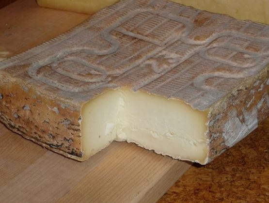 Taleggio cheese with washed rind and creamy pale paste.