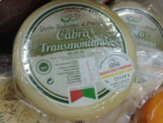 Portuguese Cabra Transmontano DOP cheese wrapped, with a green, white, and red label indicating its protected designation of origin.