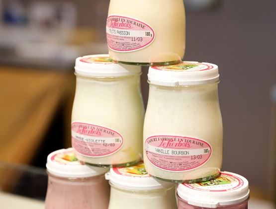 Pyramid display of Le Herbos farmhouse yogurts, made in Touraine, France.