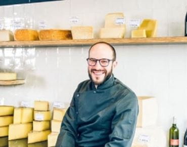Portrait of Julien Hazard, a cheesemonger. 
