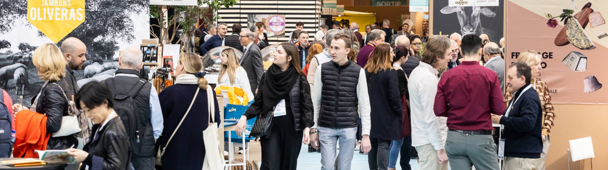 people wandering through the show aisles